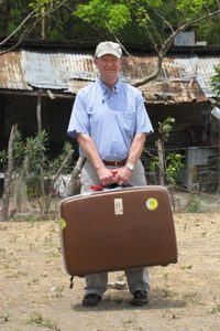 Reverend Wendell Mettey with suitcase
